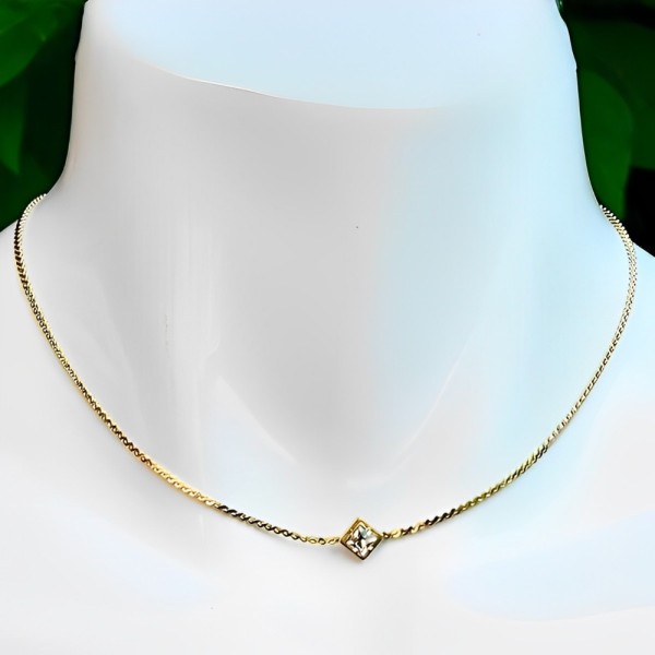 Gold Plated Serpentine Necklace with a Single Crystal circa 1980s