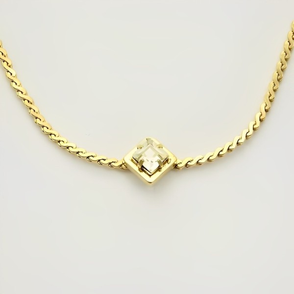 Gold Plated Serpentine Necklace with a Single Crystal circa 1980s
