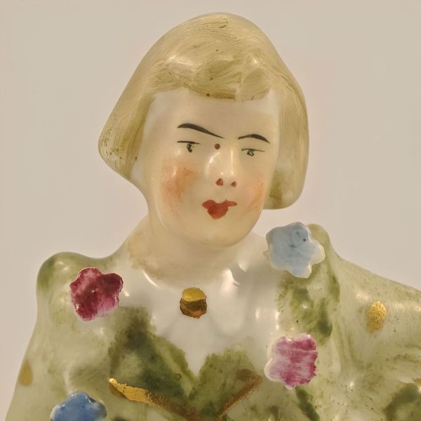 Antique Hand Painted Porcelain Man Figurine with Flowers